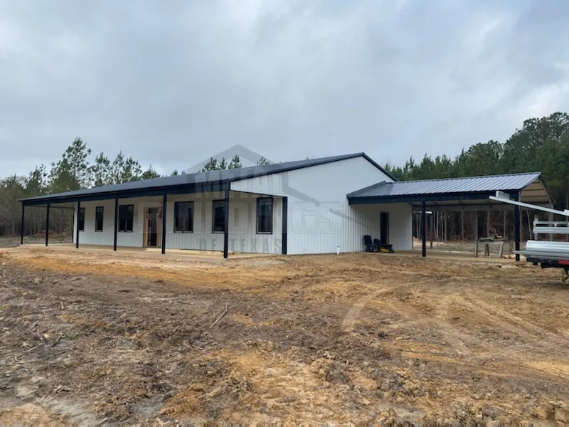 White metal building with windows and a long covered porch